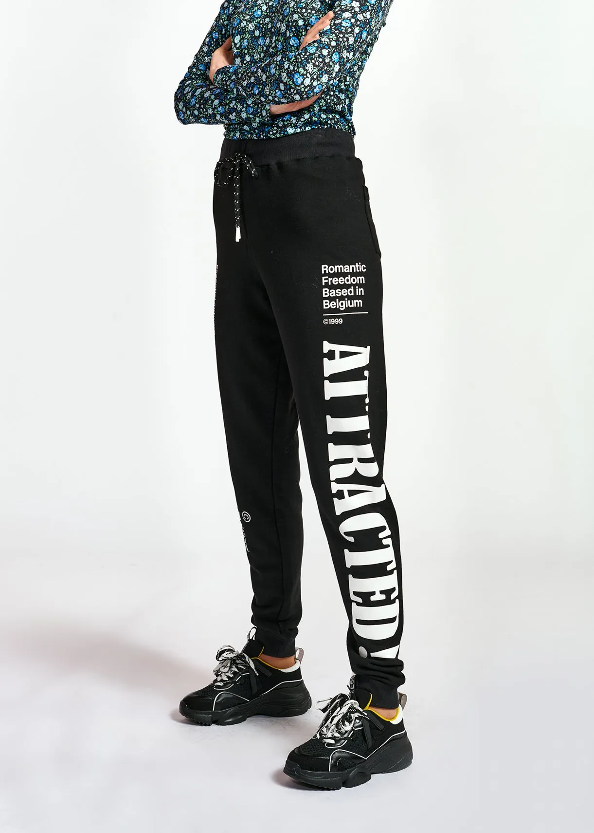 Black jersey track pants with print